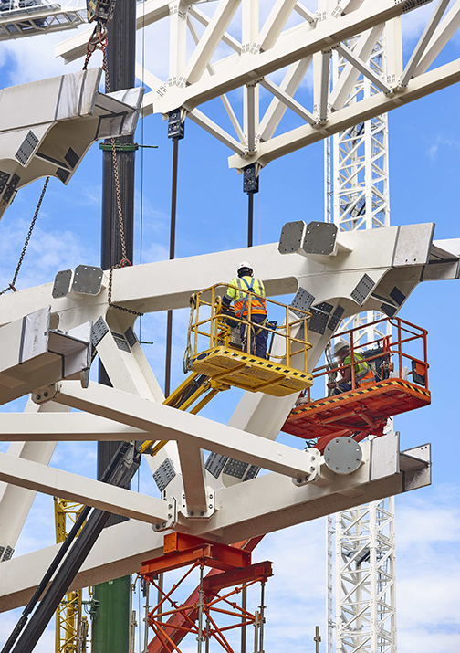 Workers on a construction site. Engineering and architectural infrastructure. Workplace